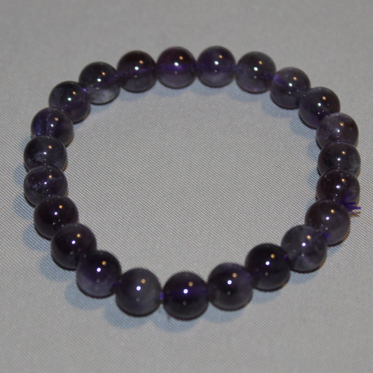 Natural High Quality Purple Amethyst processed to made into beads which are then made into a beaded bracelet