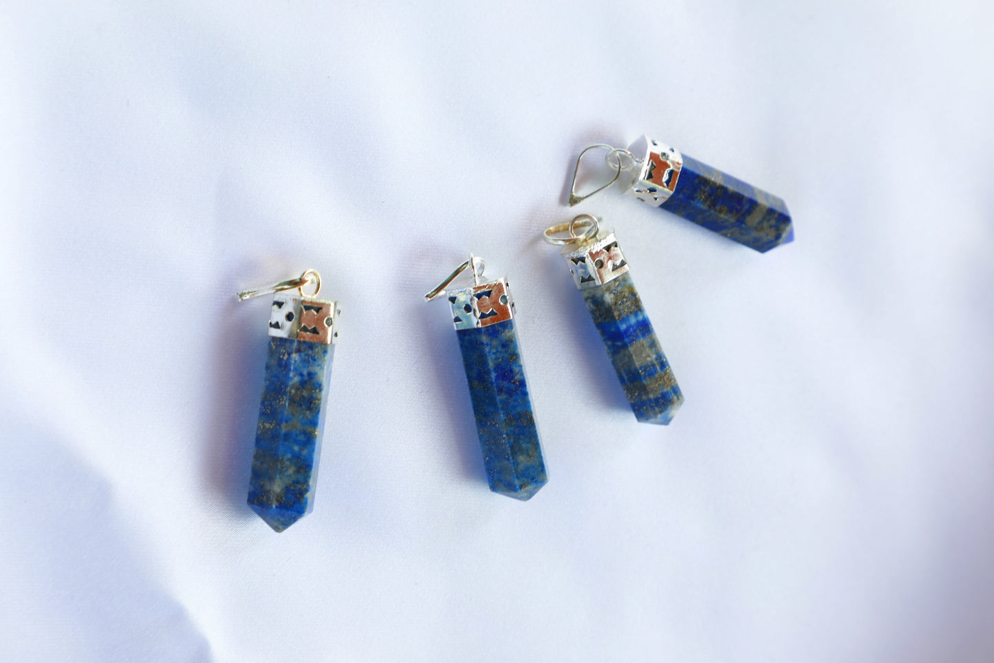 Lapis Lazuli crystal in deep royal blue with golden pyrite flecks, symbolizing wisdom, intuition, and inner truth, ideal for enhancing communication and spiritual connection.