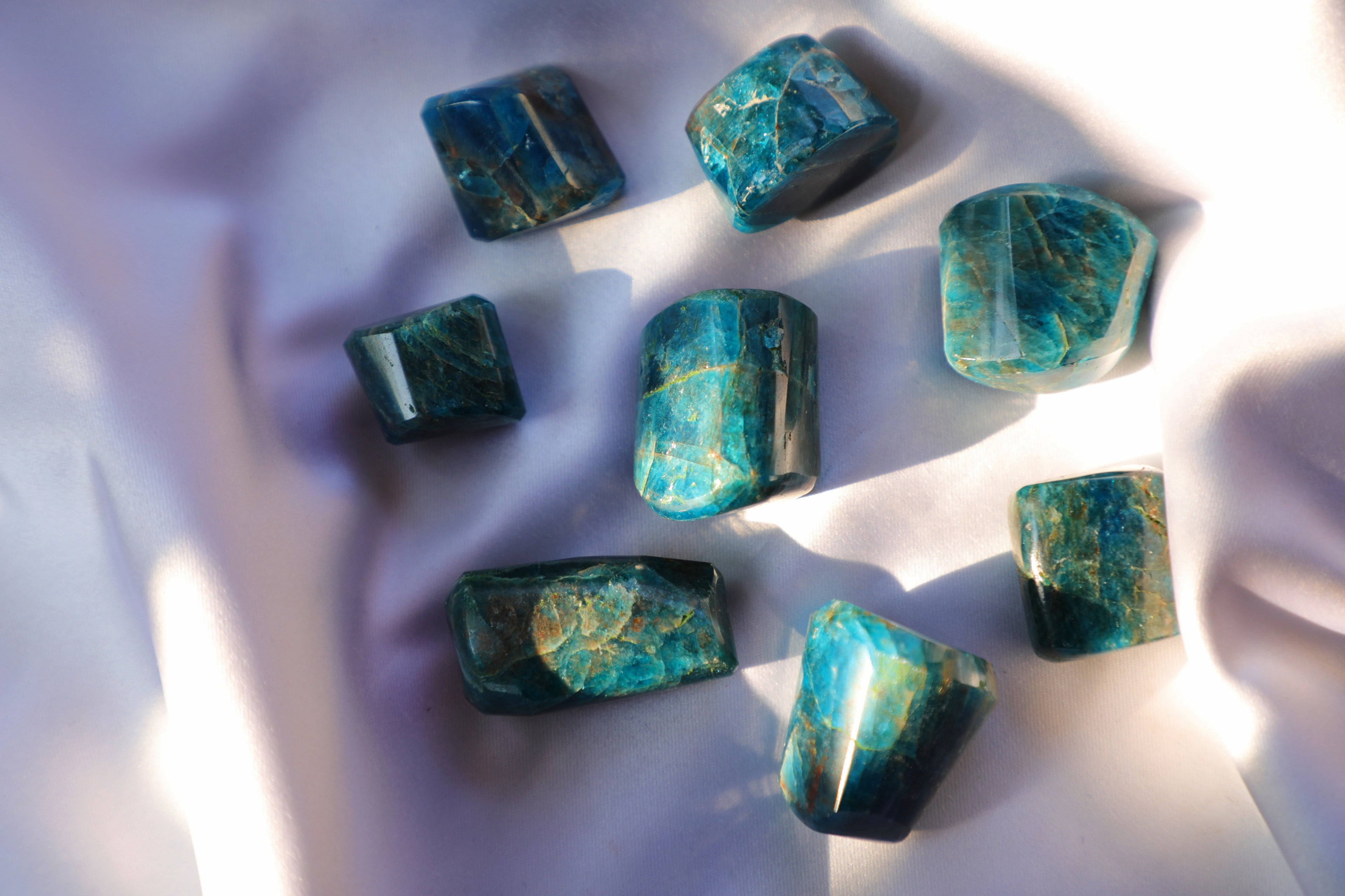 Blue Apatite crystal with vibrant blue hues, symbolizing communication, motivation, and emotional clarity. Ideal for Throat Chakra healing and personal growth.