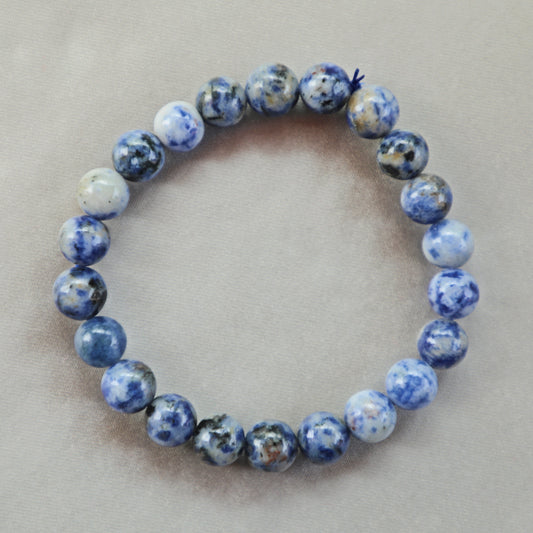 Sodalite crystal with deep blue and white marbled patterns, symbolizing clarity, truth, and calm energy.