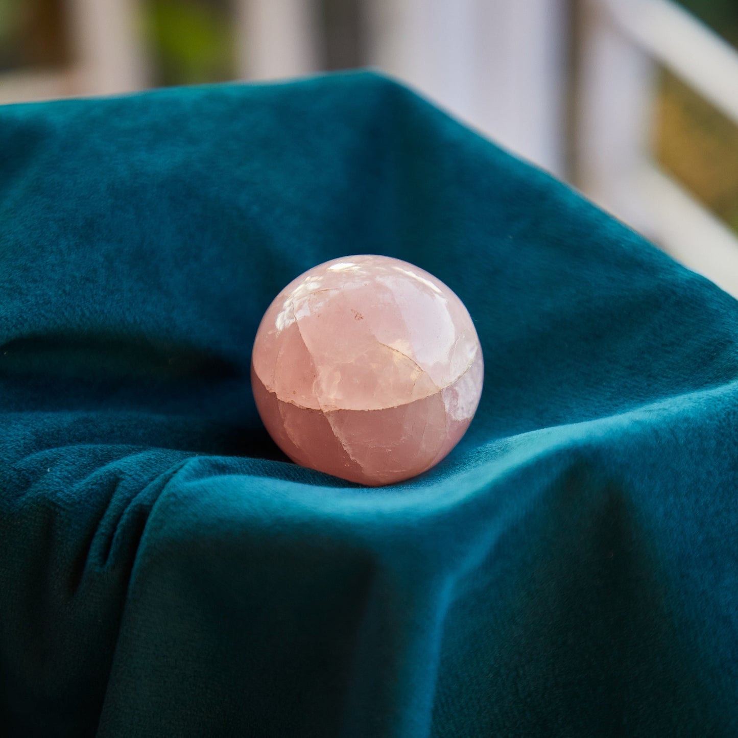 Rose Quartz crystal with a soft pink hue, known for promoting unconditional love, compassion, and emotional healing. Ideal for Heart Chakra work.