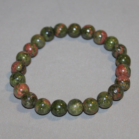 Unakite crystal featuring pink and green tones, symbolizing emotional healing, heart chakra balance, and gentle transformation.