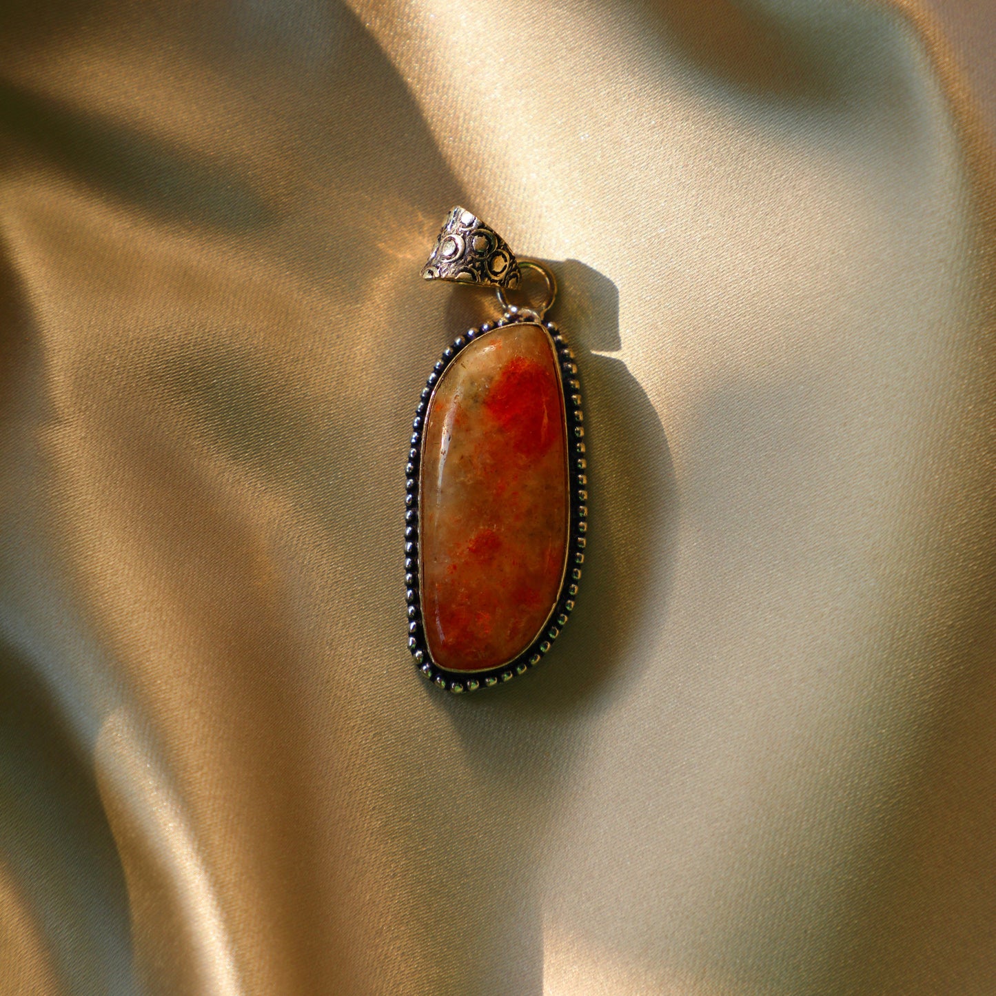Sunstone crystal with vibrant orange and golden hues, symbolizing joy, vitality, and personal power. Ideal for Sacral and Solar Plexus Chakra work.