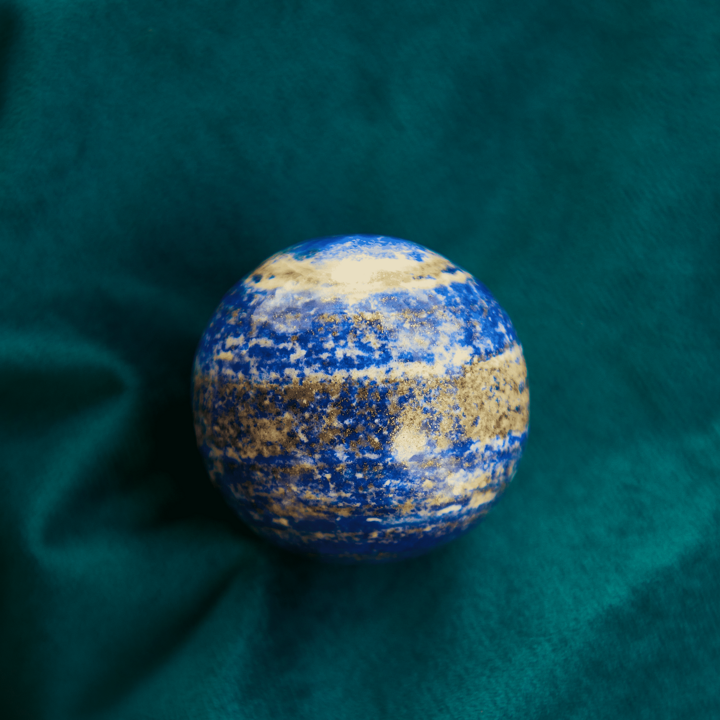 Lapis Lazuli crystal with deep royal blue color and golden pyrite inclusions, symbolizing wisdom, truth, and intuition. Ideal for Third Eye and Throat Chakra work.