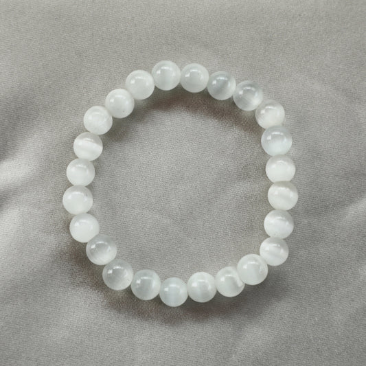 Selenite crystal in translucent white with ethereal glow, symbolizing clarity, spiritual connection, and emotional healing—ideal for meditation and energy cleansing.