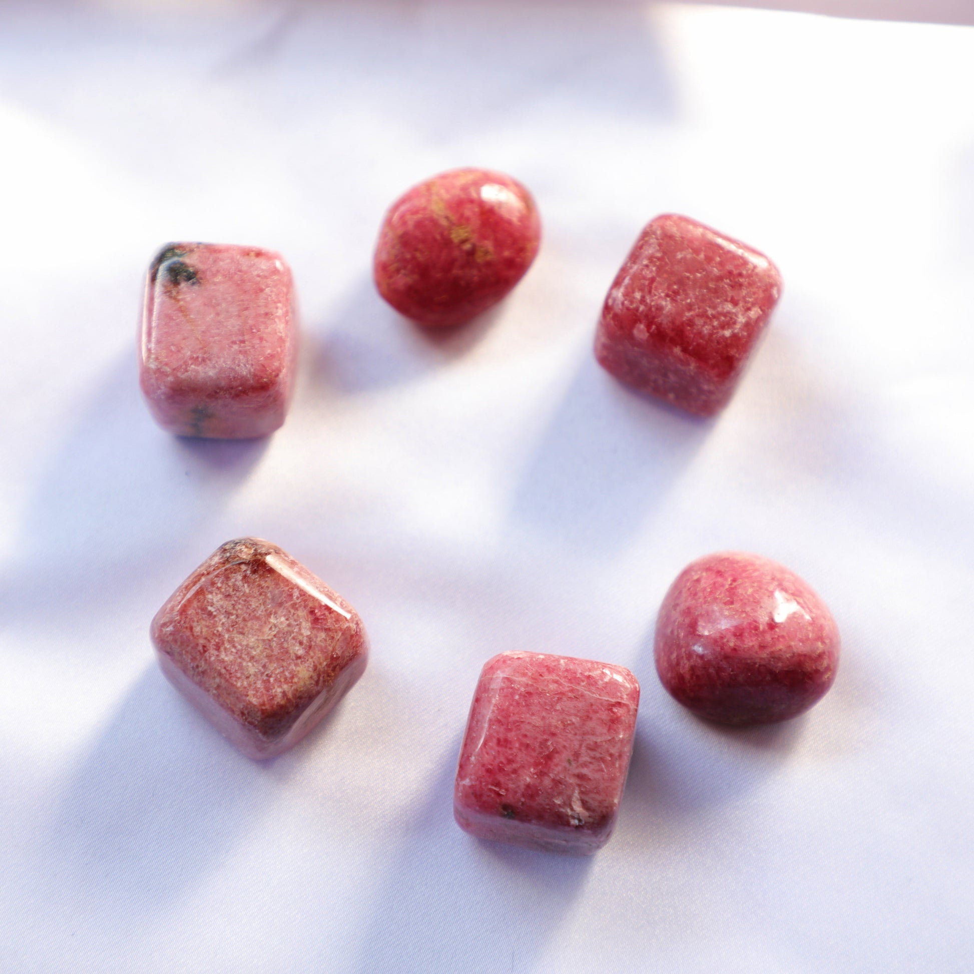 Rhodocrosite crystal with beautiful pink and white banded patterns, symbolizing love, emotional healing, and compassion. Ideal for Heart Chakra work.