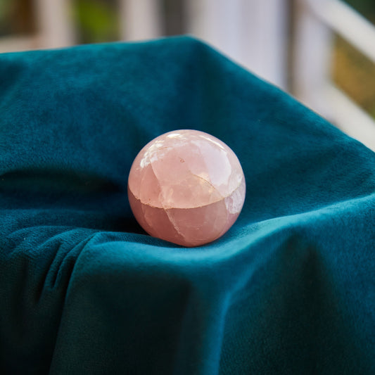 Rose Quartz crystal with a soft pink hue, known for promoting unconditional love, compassion, and emotional healing. Ideal for Heart Chakra work.
