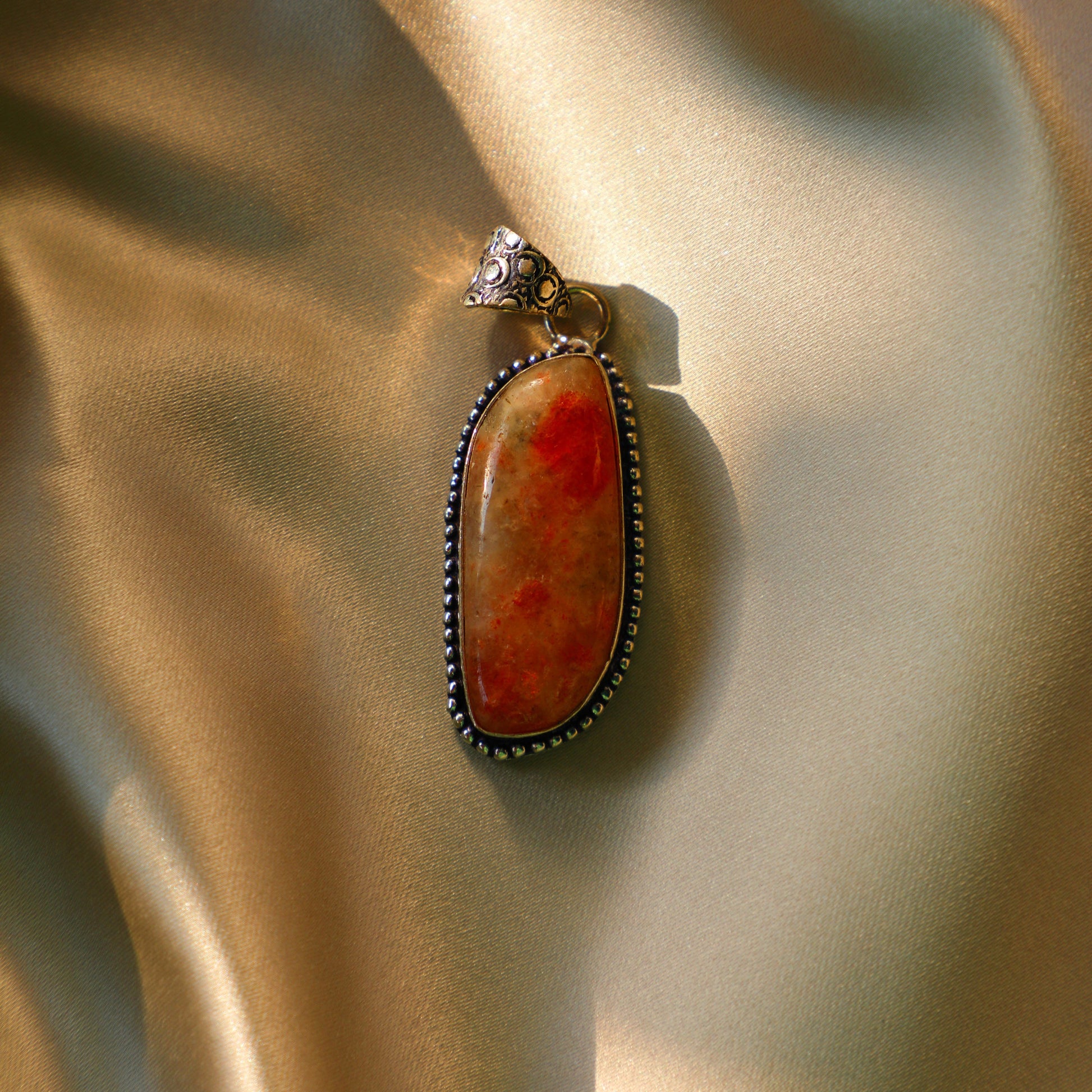 Sunstone crystal with vibrant orange and golden hues, symbolizing joy, vitality, and personal power. Ideal for Sacral and Solar Plexus Chakra work.