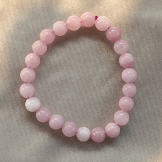 Soft pink Rose Quartz crystal symbolizing unconditional love, emotional healing, and heart-centered energy.