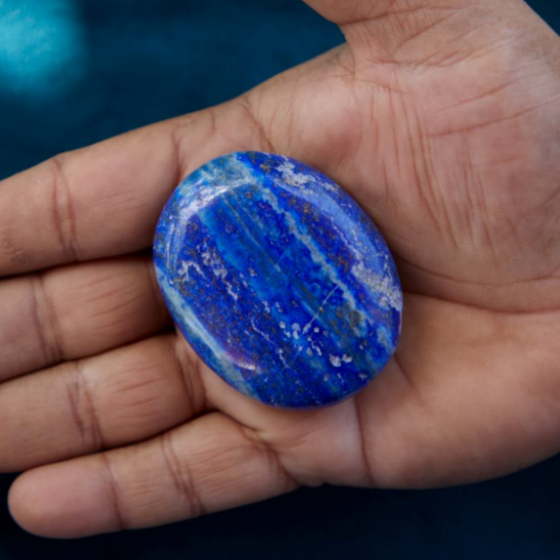 A deep blue Lapis Lazuli crystal with golden flecks, symbolizing wisdom, truth, and spiritual insight. Ideal for enhancing intuition, communication, and inner power.