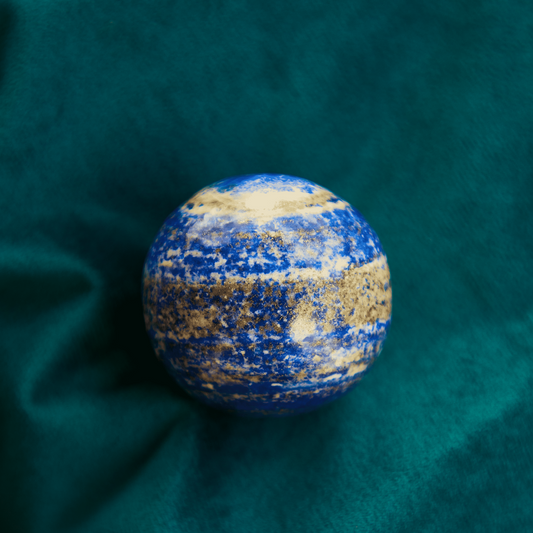 Lapis Lazuli crystal with deep royal blue color and golden pyrite inclusions, symbolizing wisdom, truth, and intuition. Ideal for Third Eye and Throat Chakra work.