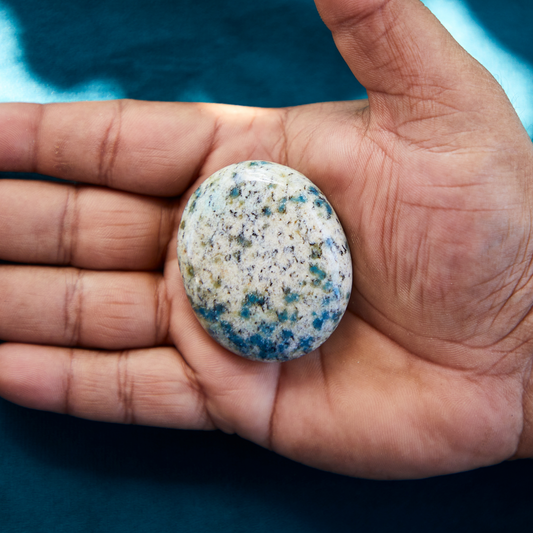 Polished K2 Jasper crystal featuring a white and gray granite base with vibrant blue azurite orbs, symbolizing clarity, balance, and higher spiritual guidance.